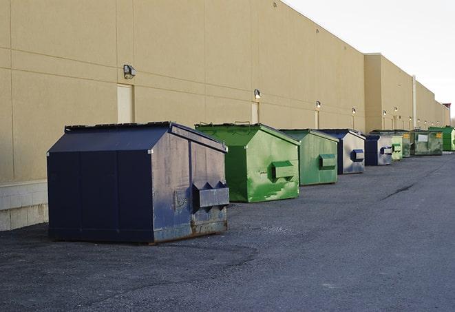 construction waste bins waiting to be picked up by a waste management company in Happy TX